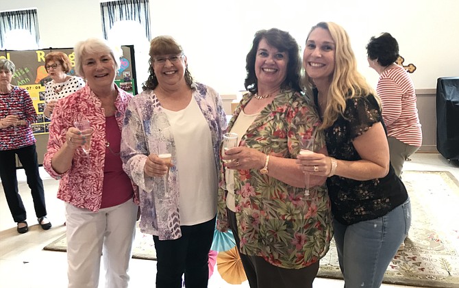 From left, Cheryl Engley – 40 years of service, Ann Chladon – 10 years of service, Joyce Burd – 20 years of service and Nora Saint Arnold – 10 years of service, celebrate and toast their long-standing teaching commitment at St. Timothy's Preschool in Herndon.