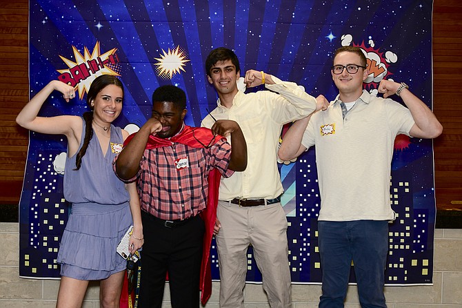 Bullis students Emma Bookoff and Zak Khera pose with Keen Athletes at the beginning of the Bullis Prom.