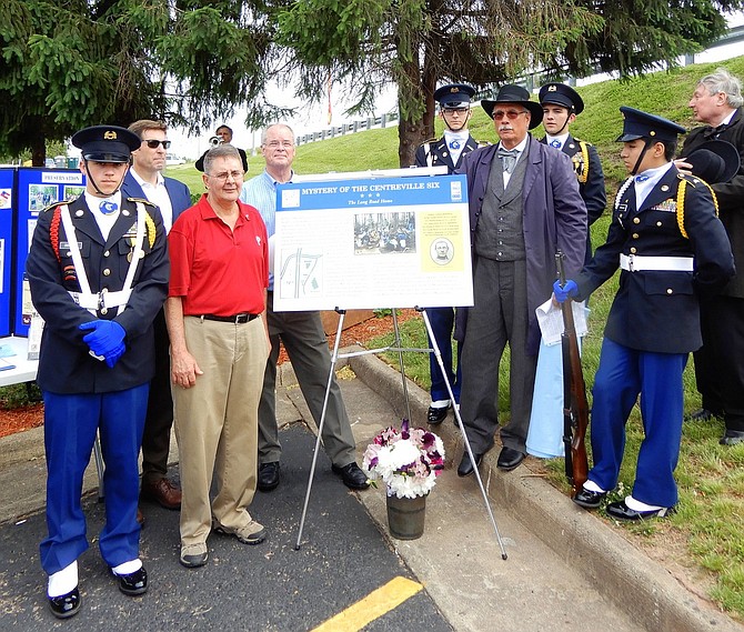 Unveiling of a historical marker honoring the Civil War soldiers found in Centreville. Former Sully District Supervisor Michael Frey is in red shirt; James Lewis is standing to the right of the marker.