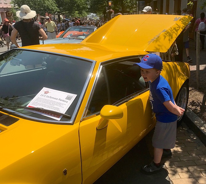 Jackson Cook of Petersburg, W. Va., checks out the inside of a 1972 De Tomasa Pantera at the Old Town Festival of Speed and Style May 19 on King Street.