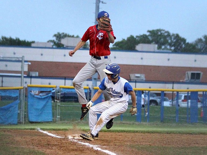 The Wolverines’ Liam Airey pulls into third on a 6th inning hit by Jacob Trumbo.