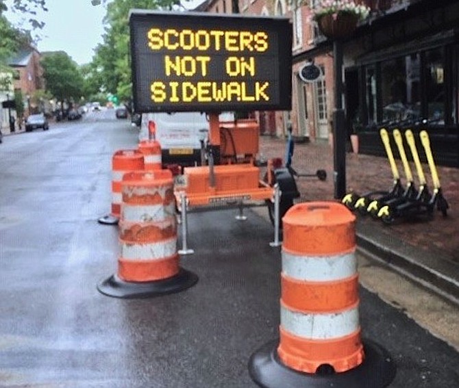The city tries to get e-scooter riders off pedestrian sidewalks and onto the street.