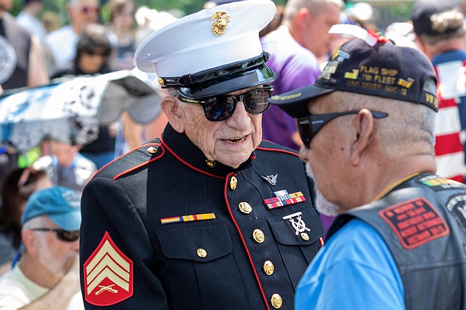 World War II veteran E. Bruce Heilman greets other veterans before the 32nd running of Rolling Thunder on May 26. Heilman is Chancellor and President Emeritus at the University of Richmond and is the national spokesperson for the Greatest Generations Foundation.