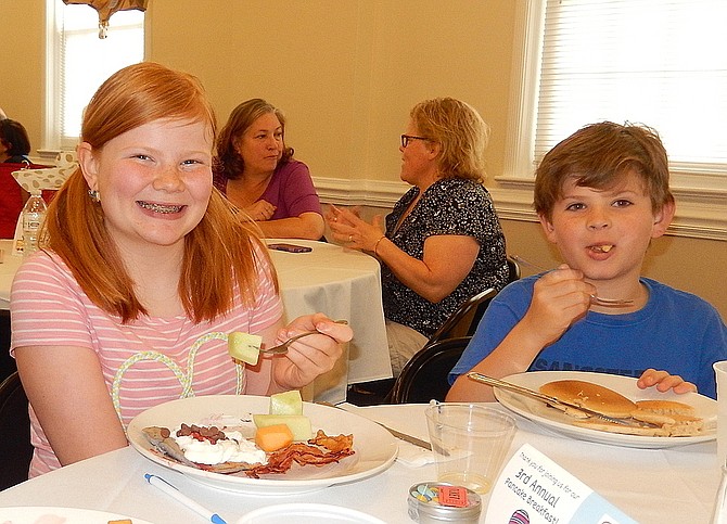 Siblings Sadie and Travis Jacobs enjoy last year’s pancake breakfast.