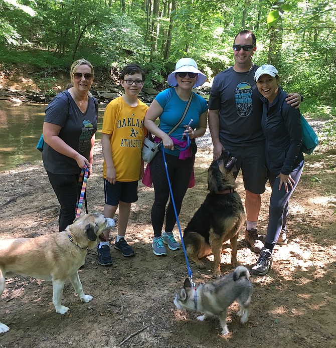 Lauren Strawbridge, right, is joined by her husband, Matt, and EveryMind staff at Cabin John Regional Park Sunday. From left are Ann Mazur, CEO; Gavin Roz, Emily Rosado, board member; Matt and Lauren Strawbridge.