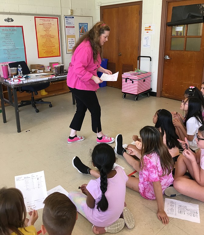 Chocolatier Sarah Dwyer discusses the business of making chocolates with Potomac Elementary School students at Career Day Thursday.