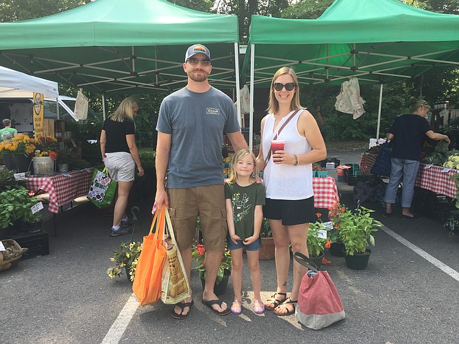 The Berry family – Daniel, Dessie, and Roux – at the Oak Marr Farmers Market.