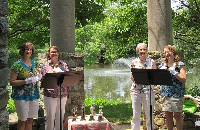 Fannie Mae Ponds & Gardens. The Grace Notes Hand Bell Quartet — Linda Brese, Fairfax; Ingrid Bowers, Reston; Marilyn Schroeder, Fairfax; and Lisa Lane, Great Falls; perform in the stone gazebo overlooking one of the two ponds frequented with Great Blue Heron.