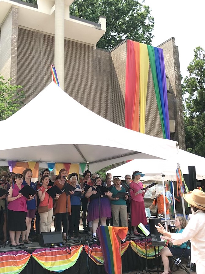 The choir for sponsoring churches of Reston Pride, conducted by Mary Lou Prince, Music Director Unitarian Universalist Church in Reston, performs a choral selection during Reston Pride 2019.