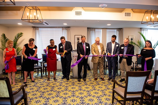 Annamarie Mariani-Huehn, Executive Operations Officer Hunters Woods at Trails Edge; Maggie Parker, Greater Reston Chamber of Commerce; Supervisor Catherine M. Hudgins (D-Hunter Mill); David Ross, Partner & President Atlantic Realty; Adam Shulman, Partner & Executive Vice President, Atlantic Realty; Rick Irwin, CEO & Co-founder, IntegraCare; Tony Crooks, Director at AEW Capital Management; Del. Kenneth Plum (D-36); and Cissy Nickel, Executive Director of Independent Living Operations at Hunters Woods at Trails Edge; all take part in the Ribbon Cutting officially opening the retirement living facility.