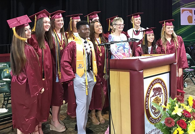 Oakton High School Class of 2019 Officers, Student Government Officers and Guest Speaker Sandy Reynolds gather before the start of the Fifty-first Commencement Exercises held at George Mason University EagleBank Arena on June 6.