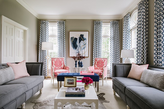 When choosing art for this room, designer Pamela Harvey found a piece that had some of the room’s existing colors, but introduced a bold pink to create a dramatic focal point on the back wall.