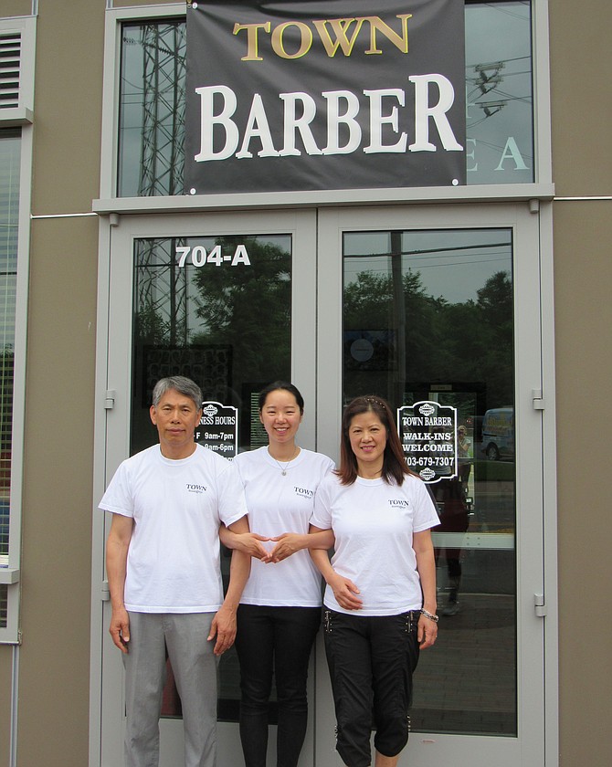 Town Barber is a locally owned family business; (from left) Luis Lim, daughter Joyce, wife Sun and a son stationed overseas at Osan Air Base, United States Air Force.