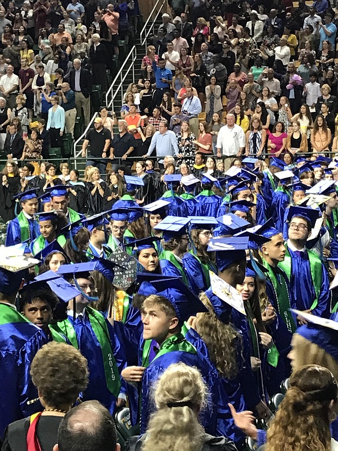 South Lakes High School Class of 2019 looks toward the stadium seating for their loved ones at George Mason University EagleBank Arena during their Commencement Ceremony held June 5.