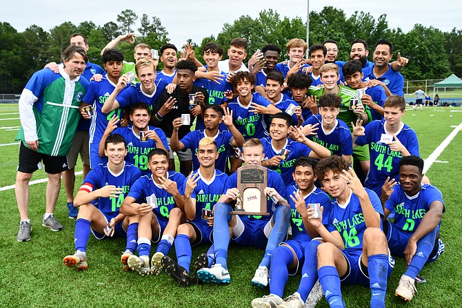 The South Lakes' team celebrates their victory at the VHSL 6A State Championships on June 8.