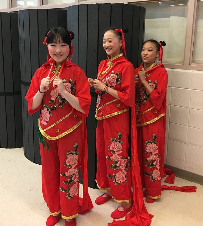 Clair Chen, Elaine Wong and Elizabeth Gao, Cabin John Middle School students, prepare to demonstrate a Chinese Ribbon Dance At the Winston Churchill High School Asian American Festival Saturday, June 1.