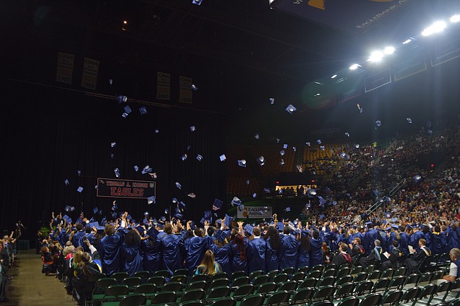 After they all walked across the stage, Edison graduates throw their caps in the air as they cheered and were officially declared graduates.