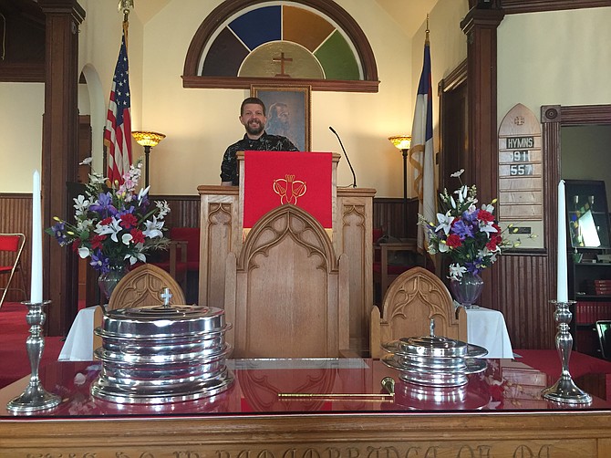 Pastor Carl Sweatman behind his pulpit.