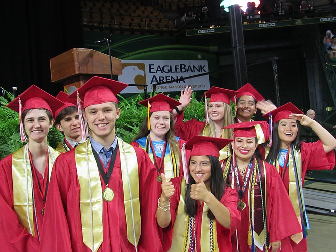 The Herndon High School Senior Class Council, Cristian Lainez, Sari Levine, Angelina Margraf, Joseph Parodi, Kelsey Rogers, Sebastien Roy (not pictured), Alison Stern, Amberly Silva-Arriaga, Ellie Wichman and Michelle Tran pose one last time before the start of the Class of 2019 Commencement.