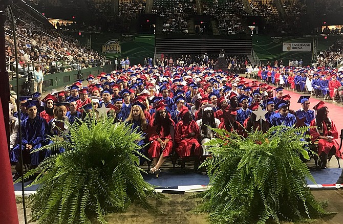 Members of the T.C. Williams High School class of 2019 await the start of graduation ceremonies June 15 at Eagle Bank Arena.