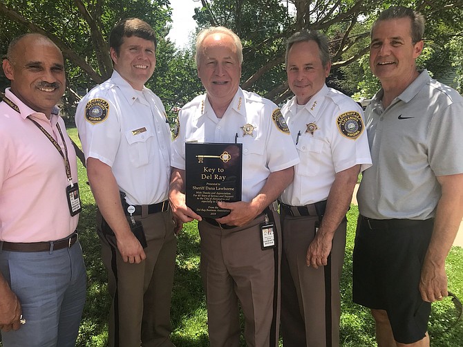 Sheriff Dana Lawhorne, center, is joined by Deputy Victor Ignacio, Lieutenant Sean Casey, Undersheriff Tim Gleeson and retired Alexandria police detective Eric Ratliff following the June 17 DRBA meeting at Del Ray United Methodist Church. Lawhorne was recognized at the meeting for his 40 years of service to the city.