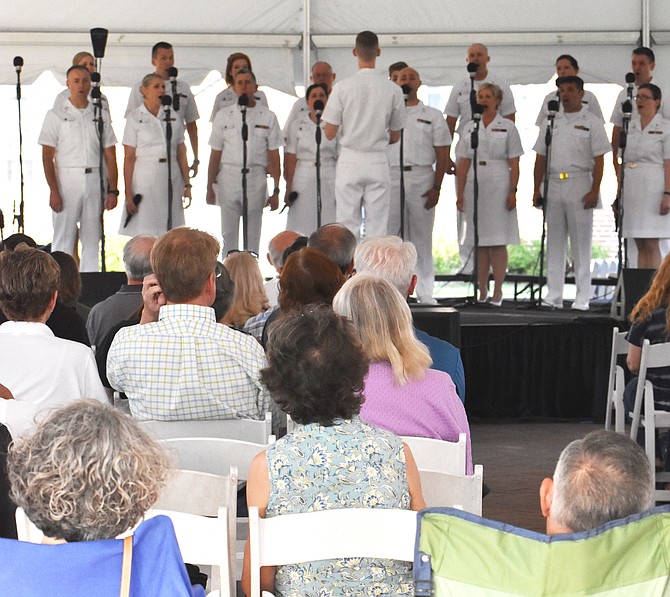 Audience members watch as the Sea Chanters sing.