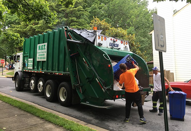 The recycle truck moves quickly through the neighborhoods.
