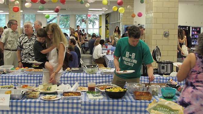 Family and faculty mingle at H-B Woodlawn’s pre-graduation potluck dinner.