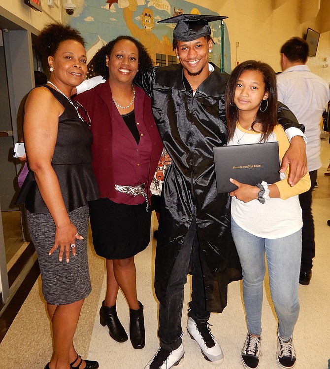 Grad Elijah Coleman with (from left) aunt Cissy Diew, mom Danielle Diew and sister Daath Coleman.