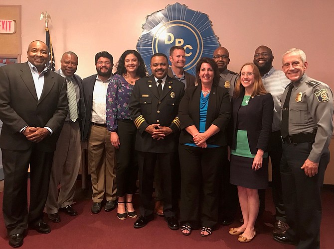 City Council members and other officials stand with the honorees at the Celebrating Our Community Leaders reception held June 24 at the Departmental Progressive Club. Shown are (from left): DPC president Merrick Malone; Alexandria Redevelopment and Housing Authority CEO and honoree Keith Pettigrew; Councilman Canek Aguirre; School board member Jacinta Greene; Acting Fire Chief and honoree Corey Smedley;  Commonwealth’s Attorney Bryan Porter; Council member Amy Jackson; Assistant Police Chief and honoree Don Hayes; Vice Mayor Elizabeth Bennett-Parker; Councilman John Taylor Chapman; and Police Chief Michael Brown.