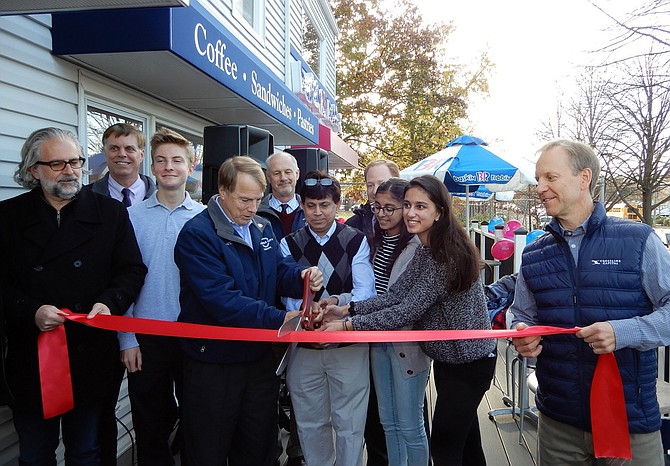 Participating in the ribbon-cutting are (from left) Michael DeMarco, Page Johnson, David Meyer, Tom Scibilia, Syed Ahmed and daughters Farjana and Syeda, and John Sabo.