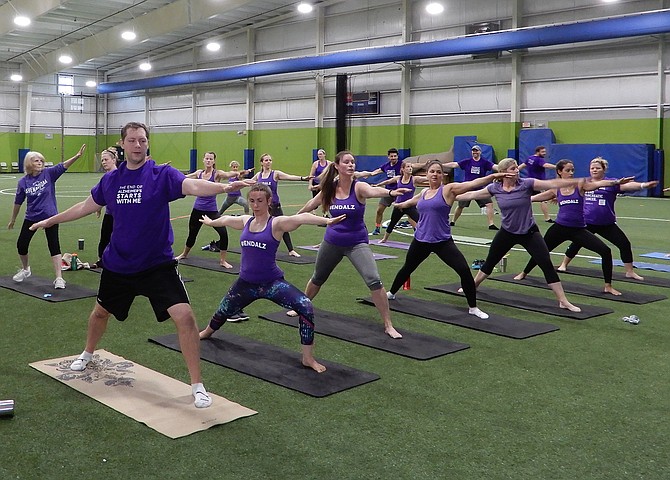 A yoga class at the Fieldhouse in Chantilly to raise money for Alzheimer’s.