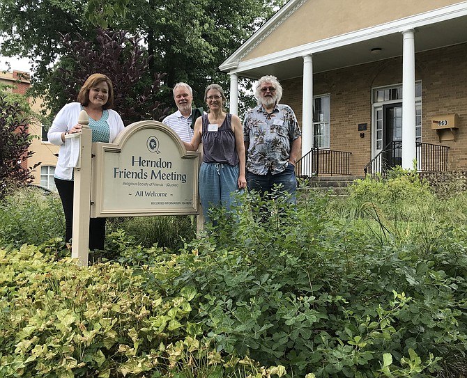 At Friends Meeting House in Herndon, worshippers Lea Wolf, Paul Murphy, Margaret Fisher and Tim McDermott stand beside one of the now thriving native gardens they and others planted late 2017. It adds form and function as it captures stormwater and infiltrates it into the soil rather than becoming runoff.