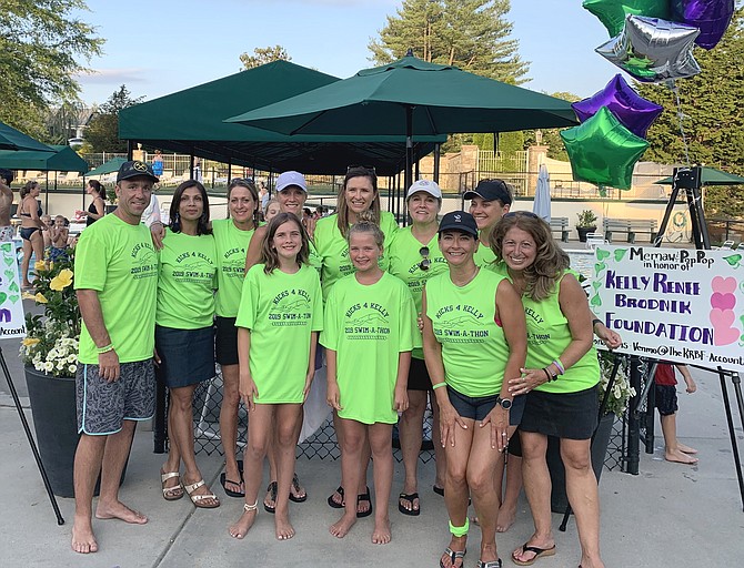 Swim team mothers and friends host first-ever Kicks for Kelly Swim-A-Thon bringing together Vienna community and supporting the Brodniks. Pictured, from left, top row: Head Coach Blair Piddington, Mona Hans, Carolyn Lynch, Kecia Harrell, Megan Wallace, Sally Payze, and Debbie Clapper); bottom row: Morgan Cunningham, Hayden Cunningham, Robin Bernhard, and Audra Hoebler.