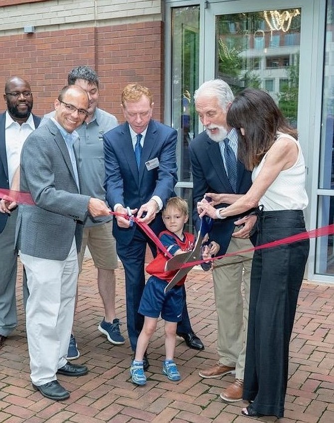 Four-year-old Joe Blackburn, son of Home Grown Restaurant Group partner Bill Blackburn, helps cut the ribbon to formally open Whiskey & Oyster July 8 in the Carlyle District. Shown are City Councilman John Chapman, Mayor Justin Wilson, Bill Blackburn, Chamber of Commerce CEO Joe Haggerty, “Mango” Mike Anderson and Donna Anderson.