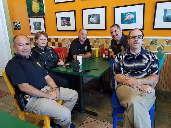 Mike Cantwell, president of Yorktown Civic Association, met with four ACPD officers to discuss neighbors’ concerns about the increase in car larceny in N. Arlington since May. From left are Lt. Eliseo Pilco, Cpl. Beth Lennon, Me Lt. Kip Malcolm, and Mike Cantwell.