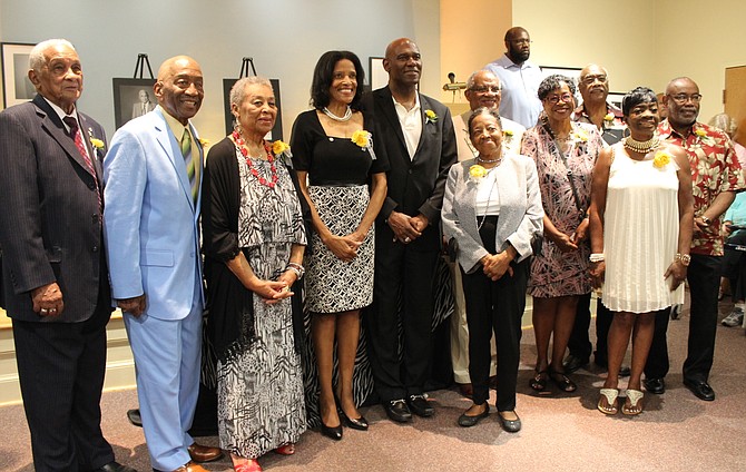 Eleven African American Living Legends of Alexandria pose for a photo at a reception at the Black History Museum. From left are: Lawrence “Robbie” Robinson, James Henson, Lillian Stanton Patterson, Florence King, Ronal Butler, Joyce Rawlings, Bill Cleveland, Ruth Cleveland, Lynnwood Campbell, Ramona Hatten, and William “Bill” Euille.