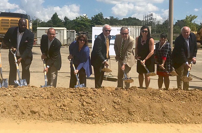 Stonebridge Principal Douglas Firstenberg, fourth from left, is joined by city representatives at the July 24 groundbreaking of Carlyle Crossing, a 1-million square foot development in Hoffman Town Center that will include the city’s first Wegmans grocery store. With Firstenberg are Councilman John Chapman, Mayor Justin Wilson, Councilwoman Amy Jackson, City Manager Mark Jinks, AEDP president Stephanie Landrum, Planning Commission member Mindy Lyle and attorney Duncan Blair.