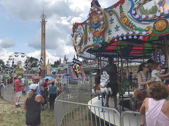 The whirl and twirl of rides by Cole Shows Amusement Company attracted crowds during Fairfax County’s 71st 4-H Fair and Carnival, held at Frying Pan Park in Herndon.