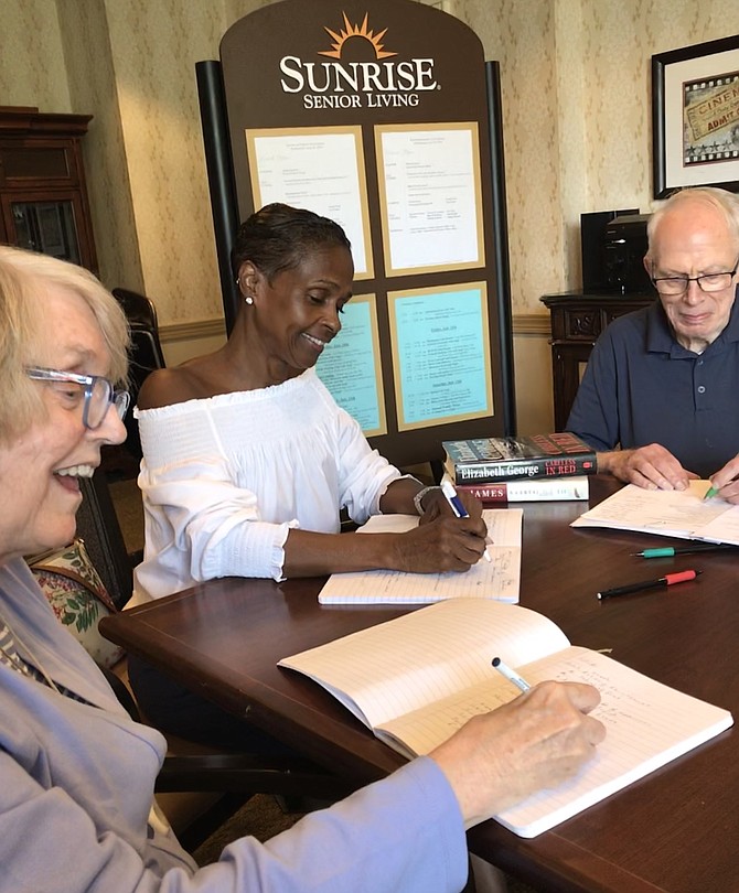 Pat O'Dwyer and John W. Beach, residents at Sunrise at Reston Town Center, discuss their current literary works with Kristin Clark Taylor, founder and facilitator of the Writers Workshop Series and Creative Conversations held at the senior living community.