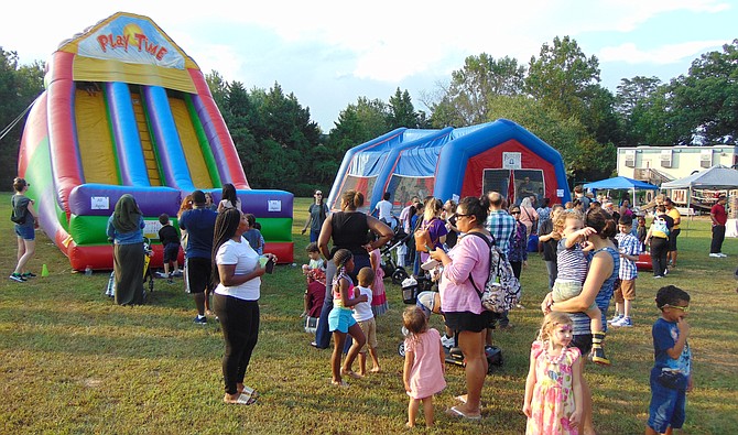 The lines for the Inflatable rides during National Night Out in Lorton.