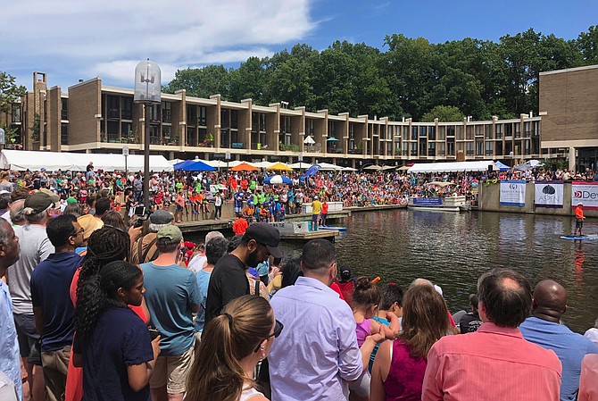 More than 3,000 people pack Lake Anne Plaza to watch the largest Cardboard Boat Regatta held there.