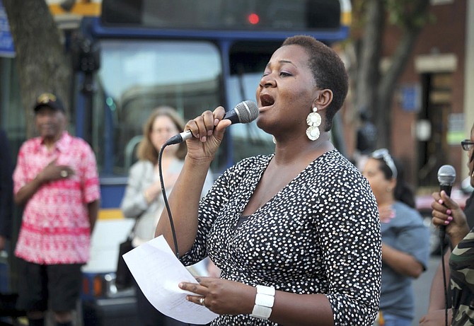 Tamara Wellons sings a variant of Amazing Grace in commemoration of Benjamin Thomas.