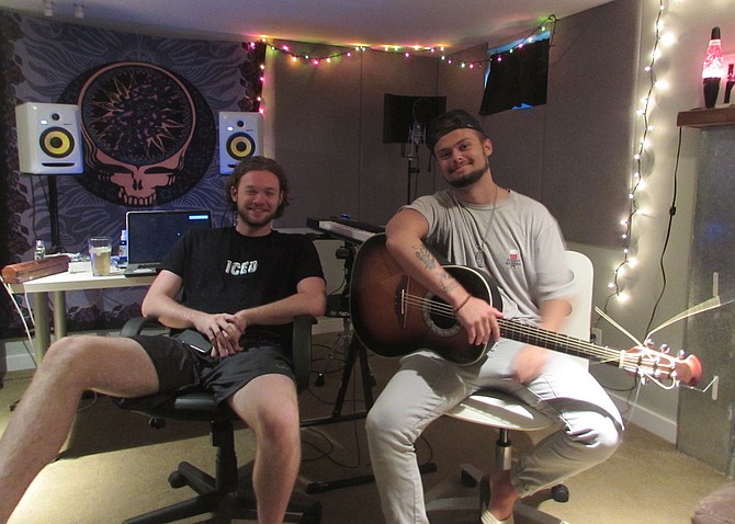 Zach Siegel (left) and George Hughes in their basement studio.