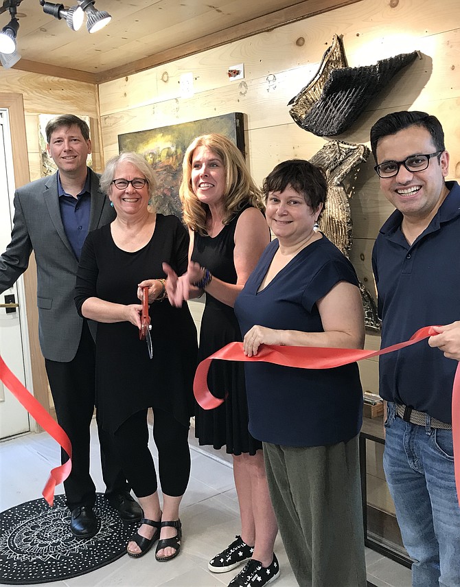 From left, Dennis Holste, Economic Development Manager, Town of Herndon; Dorian Traynham, owner of STUDIO 797; and Herndon Town Councilmembers Jennifer Baker, Signe Friedrichs and Pradip Dhakal at the ribbon cutting ceremony.