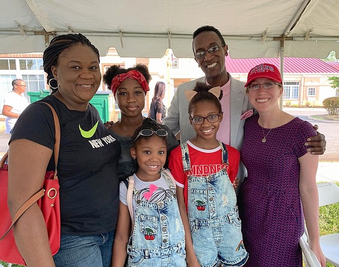 Rosemary Anyanwu, left, with daughters Ruth, Denise and Rachel, pose for a photo with Hopkins House President Glenn Hopkins and Alexandria Vice Mayor Elizabeth Bennett-Parker at the 80th anniversary Founding Day celebration Aug. 10 at the Hopkins House campus on Richmond Highway.