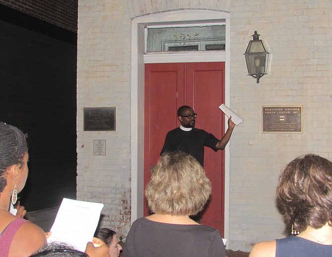 Reverend Joseph Thompson addresses the crowd in front of the Former Franklin & Armfield slave market, now Freedom House Museum.