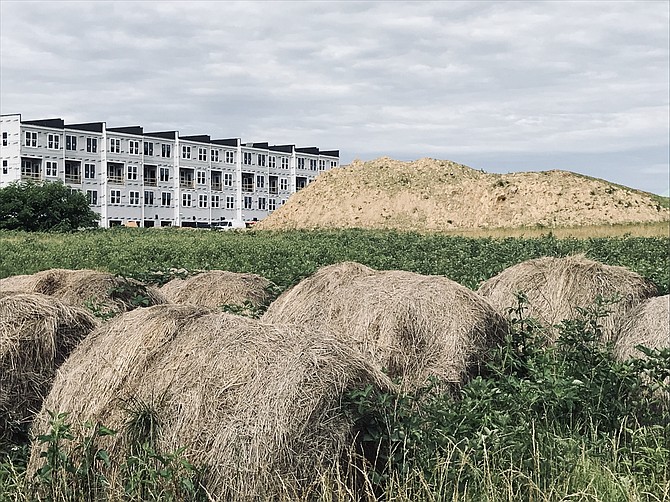 Hay bales in front of MetroPark construction at Arrowbrook, Herndon.
