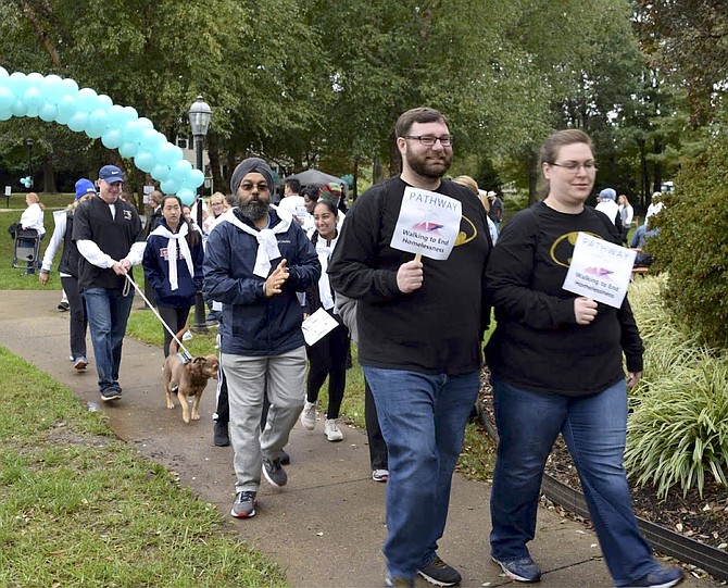 Employees and customers march in Pathway Homes’ Walk to End Homelessness.