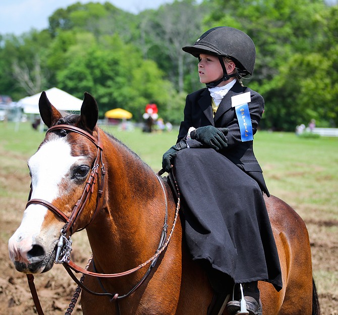 Brynn Miller riding sidesaddle. Brynn’s mother, Jo Meszoly, is raising money for Cystic Fibrosis.